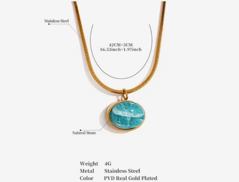 A gold-colored necklace with a teardrop-shaped amazonite pendant, presented on a pink background with text that appears to be a description or quote related to the goddess Aphrodite.