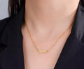 A stainless steel necklace with a winged design, displayed on a tag with an illustration of Hermes, the Greek God of commerce, wealth, and communication.